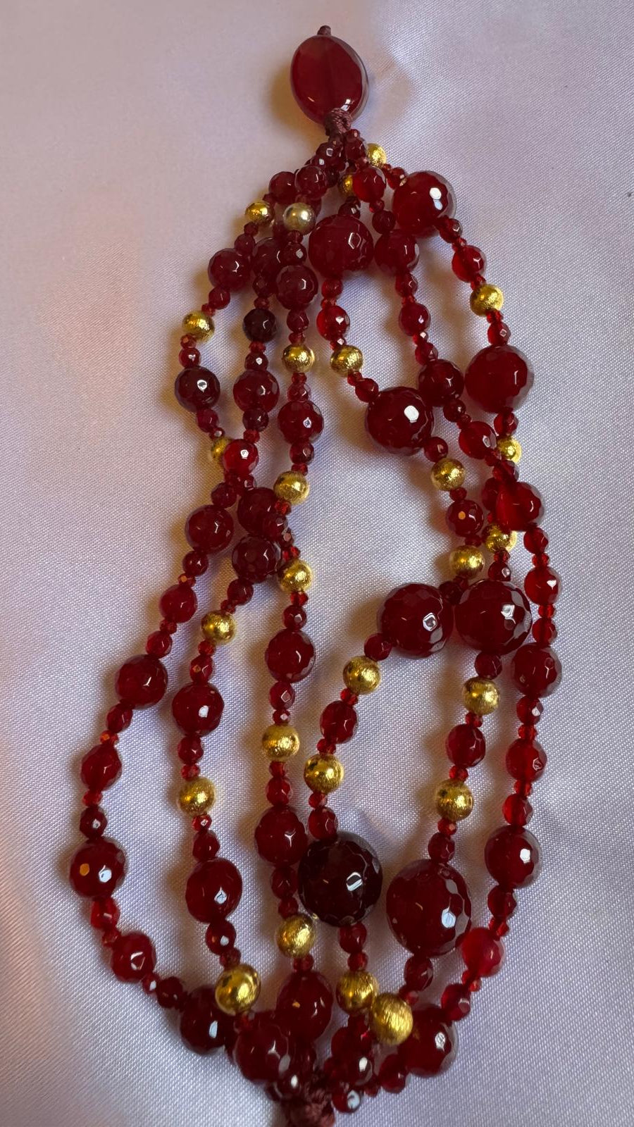 Bracelet Multi strand with Red beaded spinel and golden nuggets.