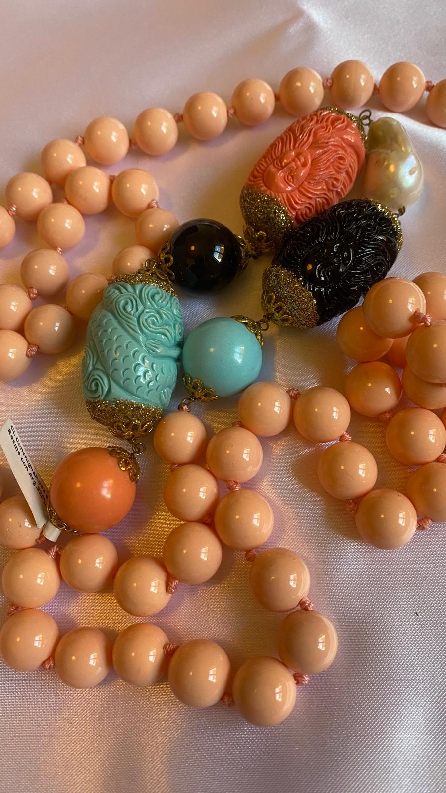 Necklace made of Pink Shell, Resin, Freshwater Pearls, and Onyx.
