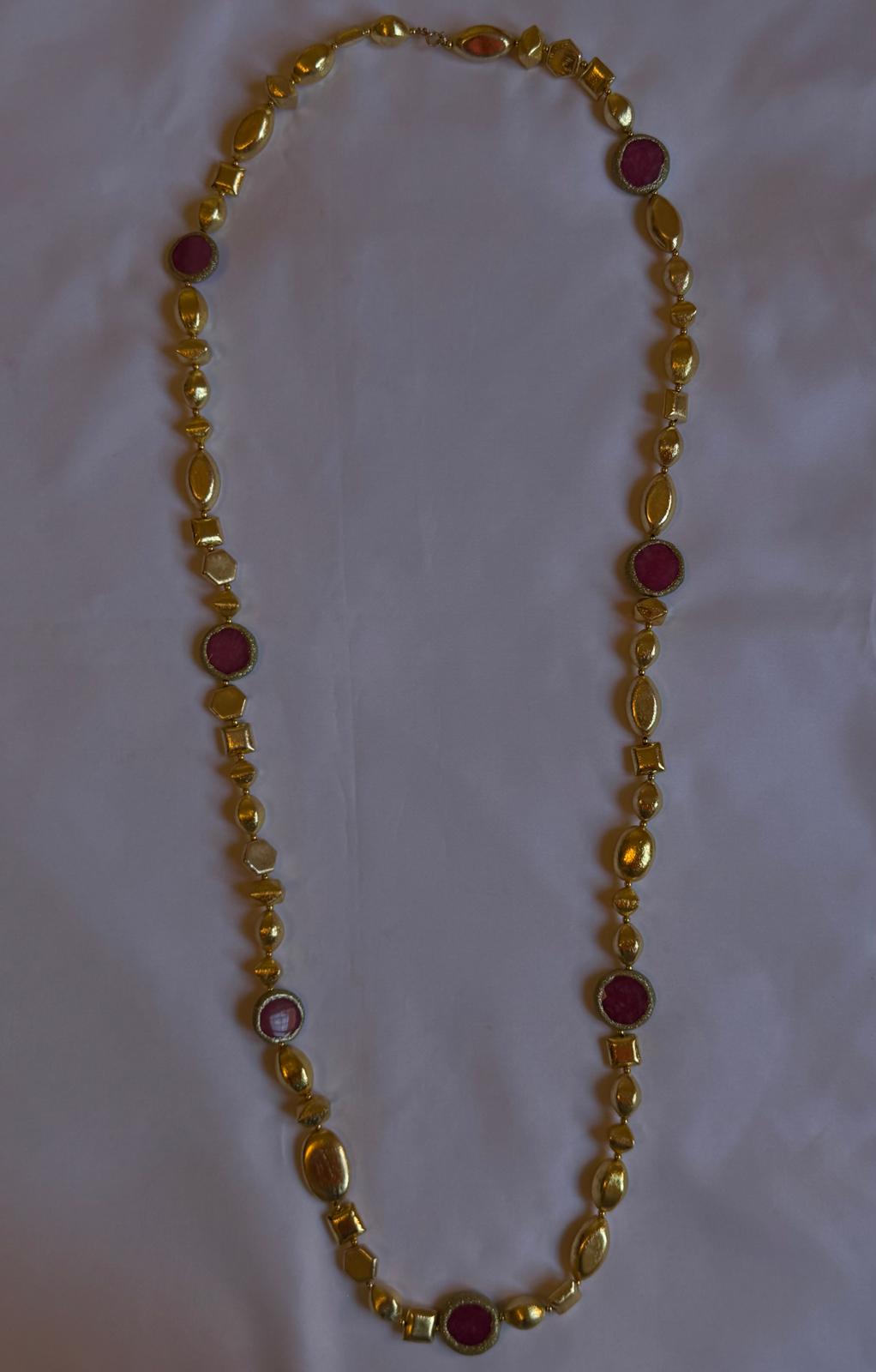Gold necklace with red stones