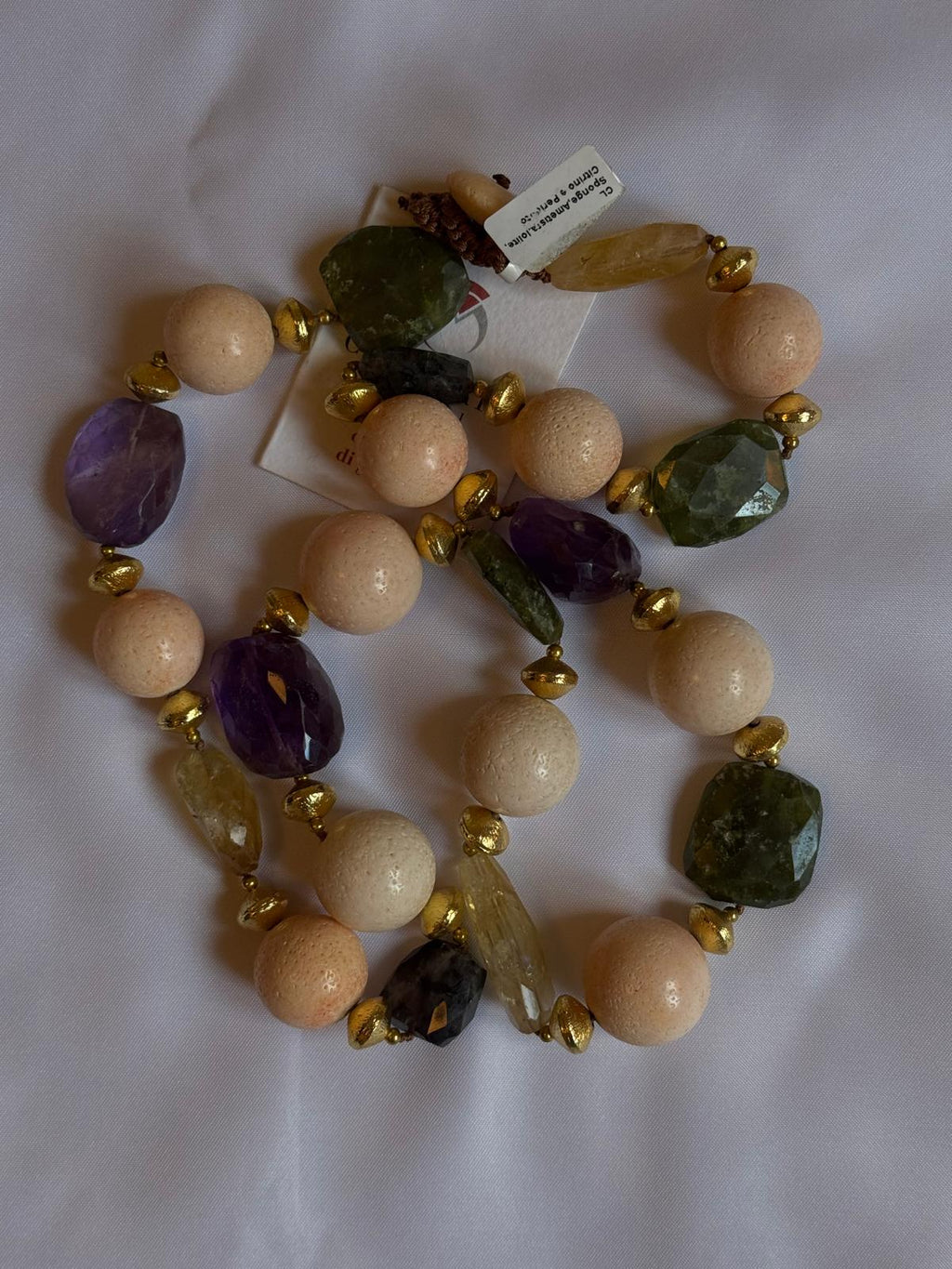 Necklace made with sponge, amethyst, citrine quartz and peridot.