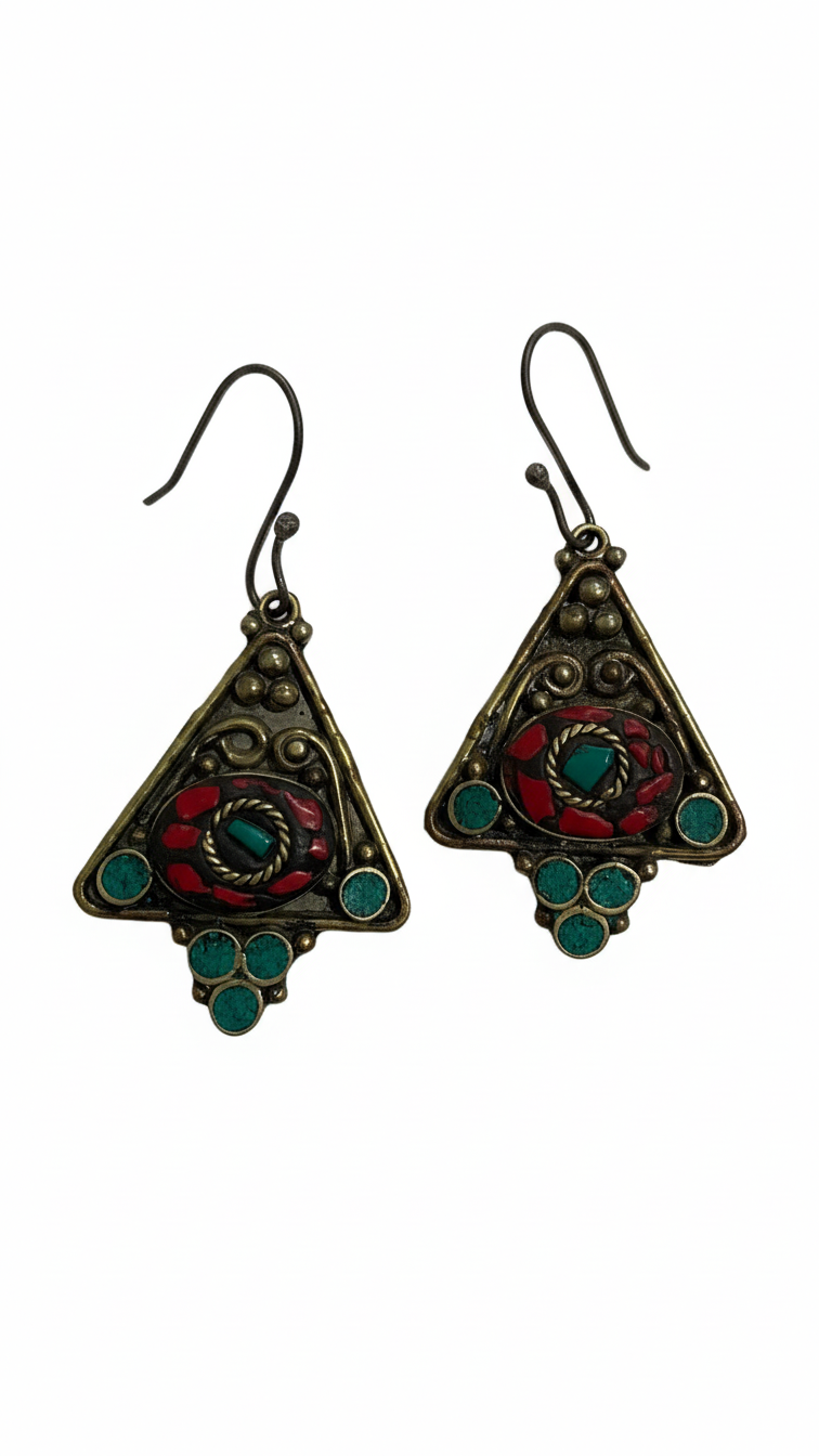 Pair of triangular earrings with red and green accents on a white background